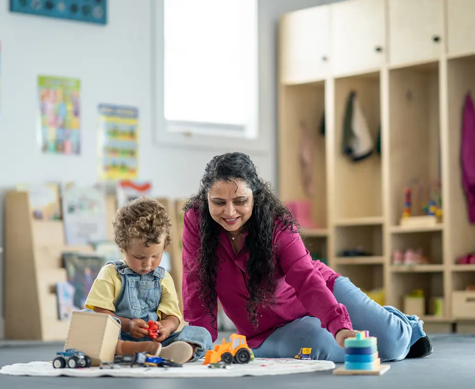 Child and adult playing with toys