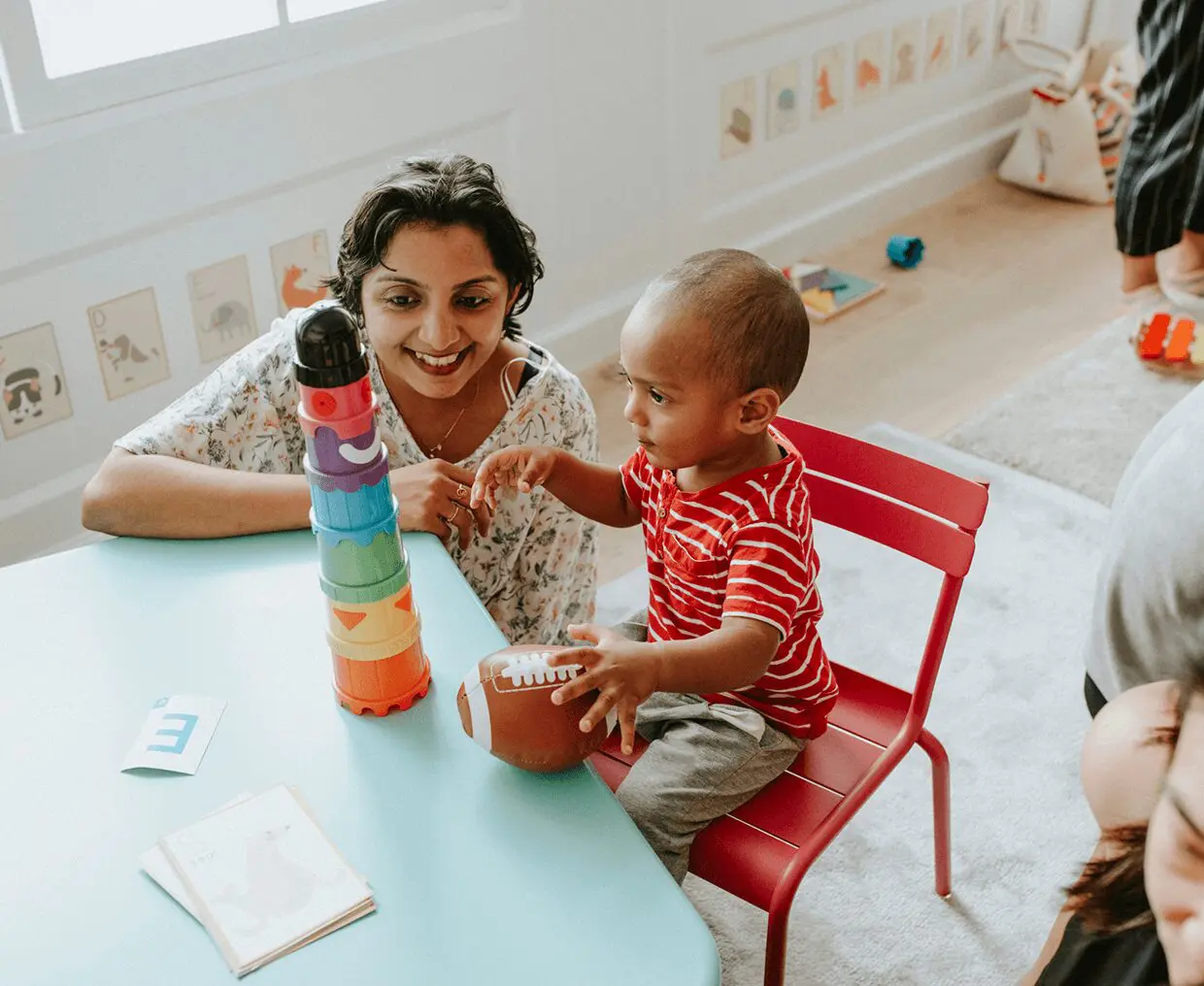 Toddler and adult enjoying playtime together