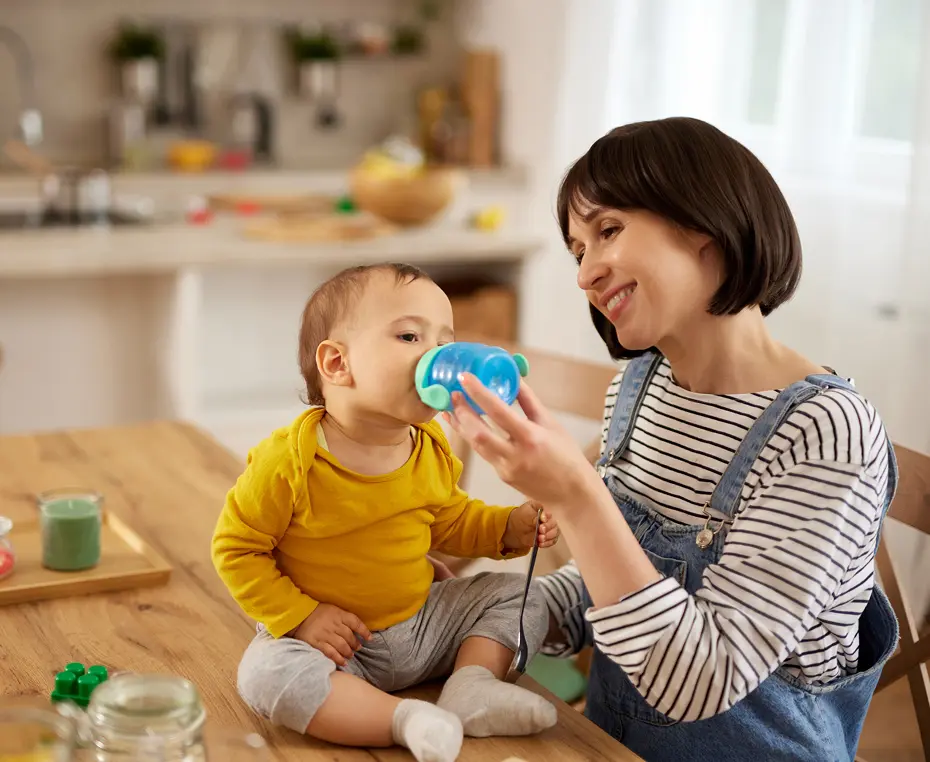 Mother and baby playing in kitchen