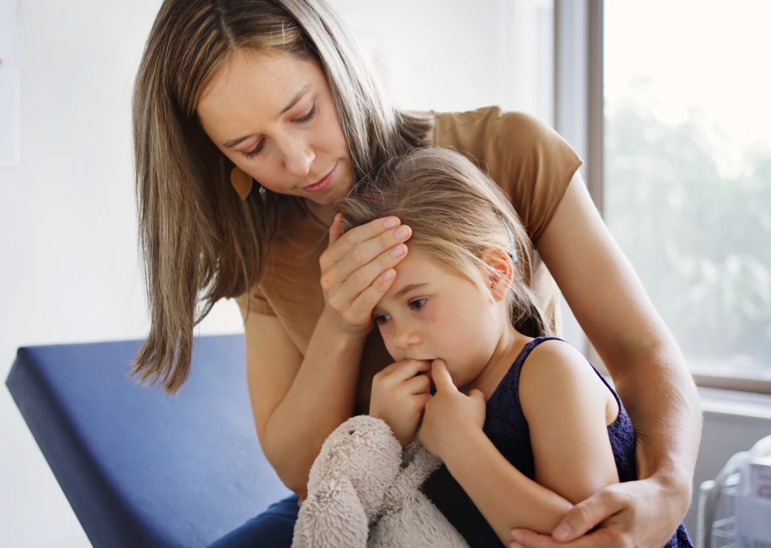 Woman comforting a worried child